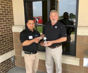 (Pictured presenting the award from L-R: Joe Medina and Group Safety Director Michael Parker)